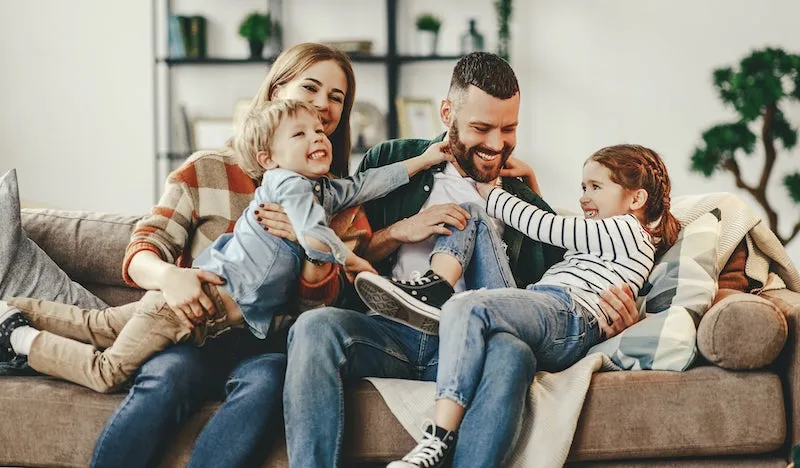 keystone insurance utah smiling family on couch